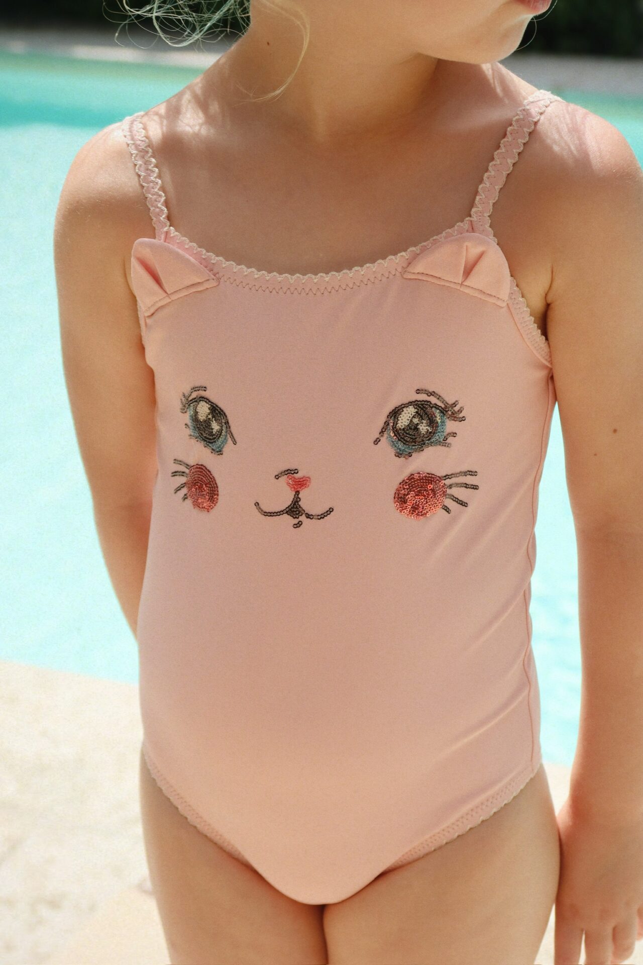Konges Slojd pink kitty swimsuit with sequin cat face and back bow